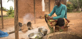Beatrice Boakye, cocoa farmer in Ghana, preparing lunch her home.